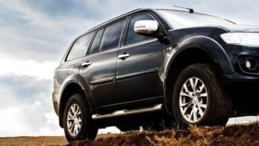 A close look at an SUV on a hill.